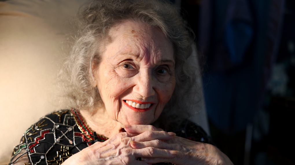 Magician Gloria Dea poses at her Las Vegas home on Tuesday, Aug. 9, 2022. Dea, touted as the first magician to perform on what would become the Las Vegas Strip in the early 1940s, has died. One of Dea's caretakers said she died Saturday, March 18, 2023, at her Las Vegas residence. She was 100. (K.M. Cannon/Las Vegas Review-Journal via AP)