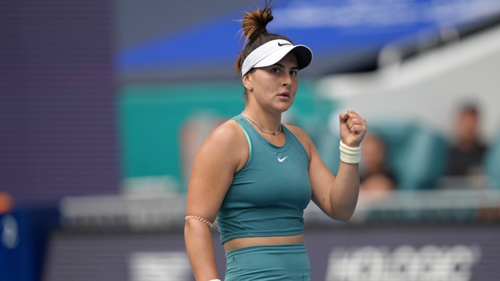 Bianca Andreescu, of Canada, celebrates a point against Emma Raducanu, of Great Britain, in the first set of a match at the Miami Open tennis tournament, Wednesday, March 22, 2023, in Miami Gardens, Fla. (AP Photo/Jim Rassol)