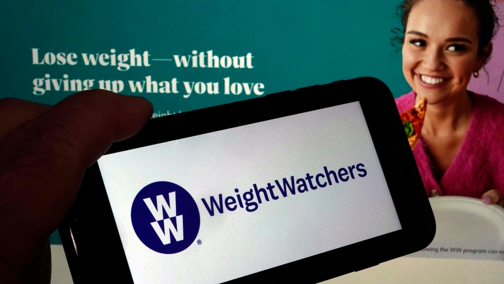 This image shows the logo of WeightWatchers on a mobile phone, and the company's website, in New York, Tuesday, March 7, 2023. (AP Photo/Richard Drew)