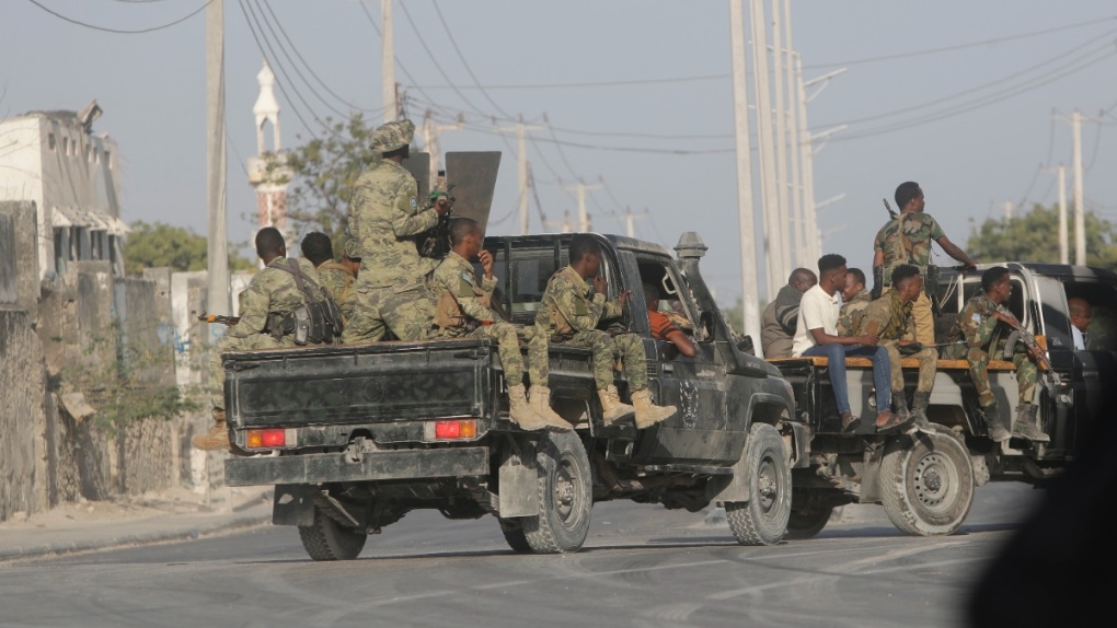 Security patrol the streets during fighting between al-Shabab extremists and soldiers in Mogadishu, Somalia, on Feb. 21, 2023. (Farah Abdi Warsameh / AP) 