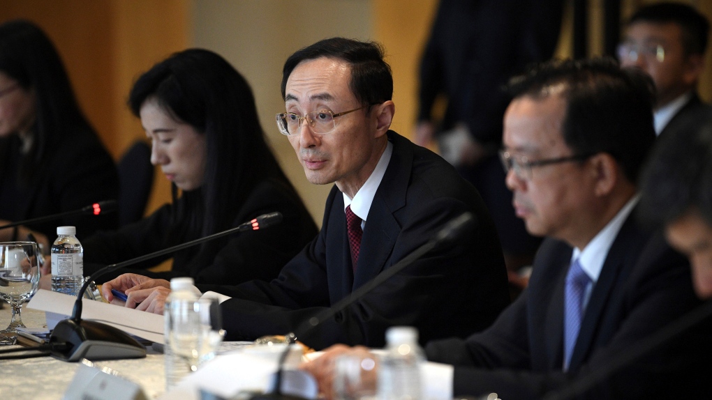 Sun Weidong, centre, China's vice foreign minister, delivers his opening statement during the Philippines-China Foreign Ministry consultation meeting at a hotel in Manila on Thursday March 23, 2023. (Ted Aljibe/Pool via AP)