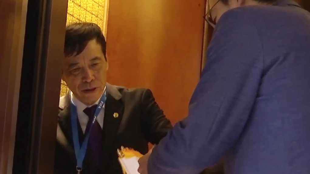 In this image made from video, Chen Xuyuan, head of the Chinese Football Association, gets on an elevator in Shanghai, Oct. 24, 2019. China’s scandal-plagued official Football Association has been rocked by new corruption probes into its chiefs of discipline and competition. (AP Photo, File)