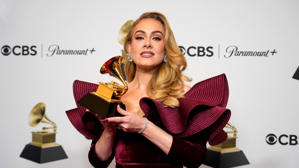 Adele, winner of Best Pop Solo Performance for "Easy on Me," poses in the press room at the 65th annual Grammy Awards on Sunday, Feb. 5, 2023, in Los Angeles. (AP Photo/Jae C. Hong)