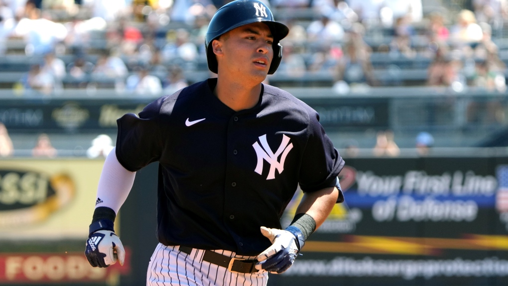 New York Yankees' Anthony Volpe rounds the bases after hitting a two run homer in the second inning of a spring training baseball game against the Minnesota Twins, Friday, March 24, 2023, in Tampa, Fla. (AP Photo/John Raoux) 