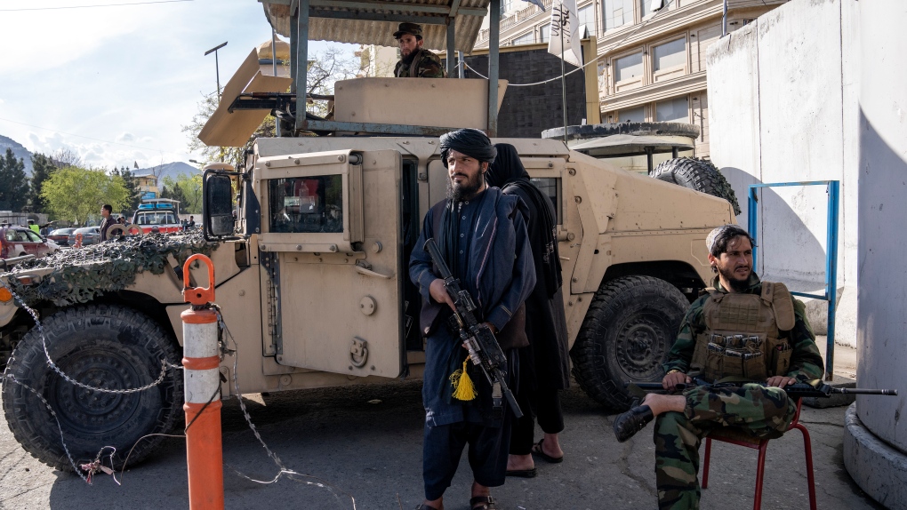 Taliban fighters stand guard at the explosion site, near the Foreign Ministry in Kabul, Afghanistan, Monday, March 27, 2023. (AP Photo/Ebrahim Noroozi)