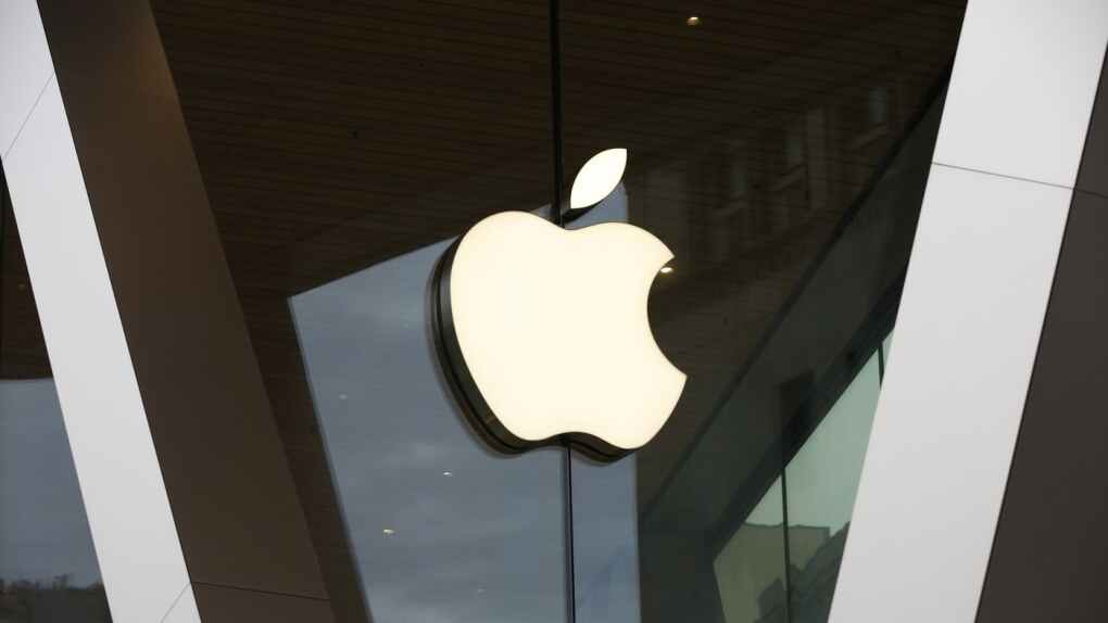 An Apple logo adorns the facade of the downtown Brooklyn Apple store on March 14, 2020, in New York. Apple is getting into the Buy Now, Pay Later space with a few tweaks to the existing model — including no option to pay with a credit card. The company will roll out the product to some consumers spring 2023, and will begin reporting the loans to credit bureaus in the fall. (AP Photo/Kathy Willens, File)