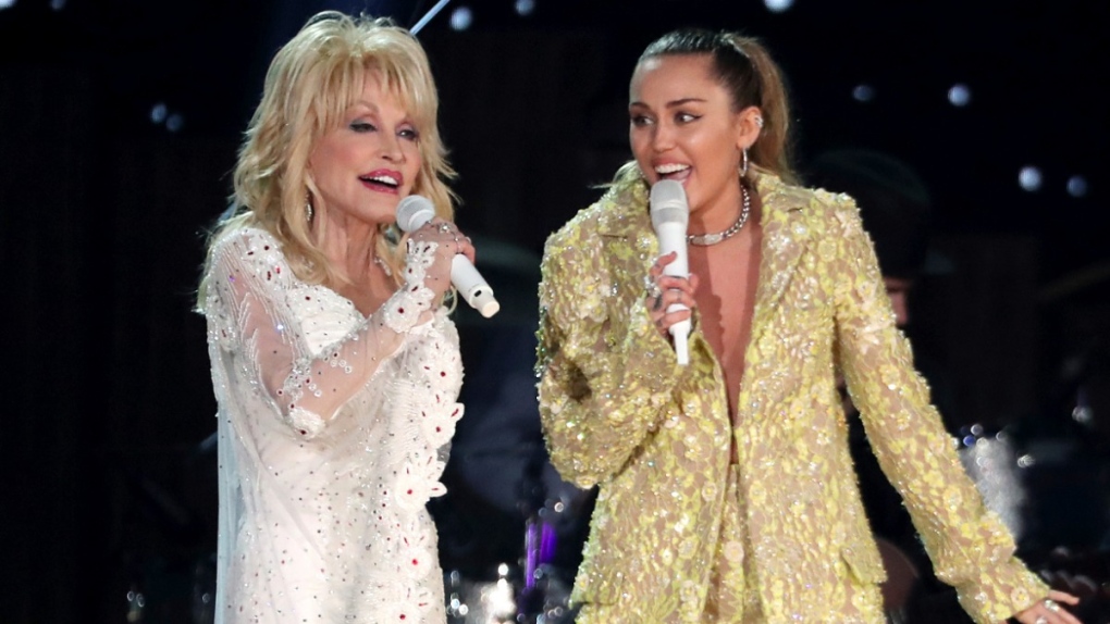 Dolly Parton and Miley Cyrus perform at the Grammys. (Source: Matt Sayles / Invision / AP via CNN)