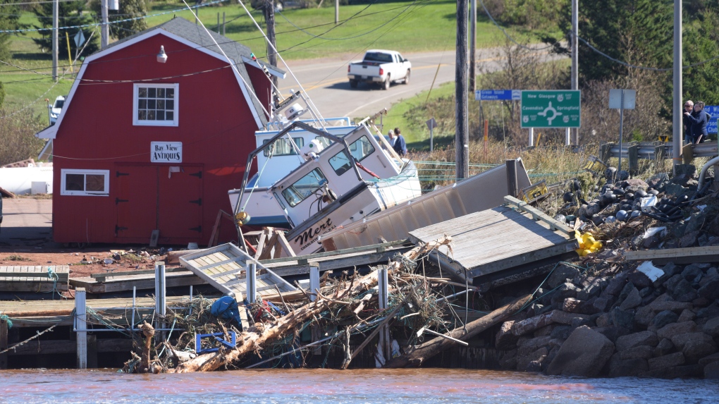 Damage from post-tropical storm Fiona at the wharf in Stanley Bridge, P.E.I. on Sunday September 25, 2022. The federal government will help Canadians prepare to withstand the floods, fires and heat waves climate change is expected to unleash. THE CANADIAN PRESS/Brian McInnis