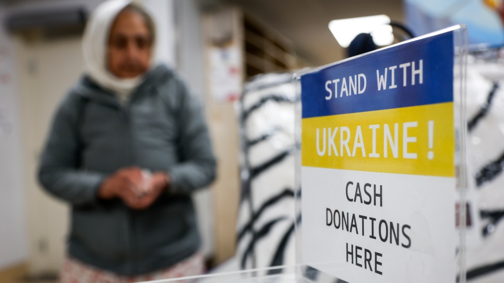 Members of the Sikh community give donations to a "Stand with Ukraine" campaign at the Dashmesh Cultural Centre in Calgary, Alta., Saturday, April 9, 2022.THE CANADIAN PRESS/Jeff McIntosh