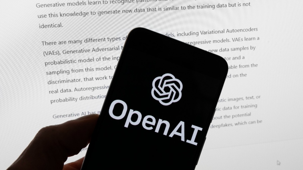 The OpenAI logo is seen on a mobile phone in front of a computer screen displaying output from ChatGPT, in Boston, on March 21, 2023. (Michael Dwyer / AP) 