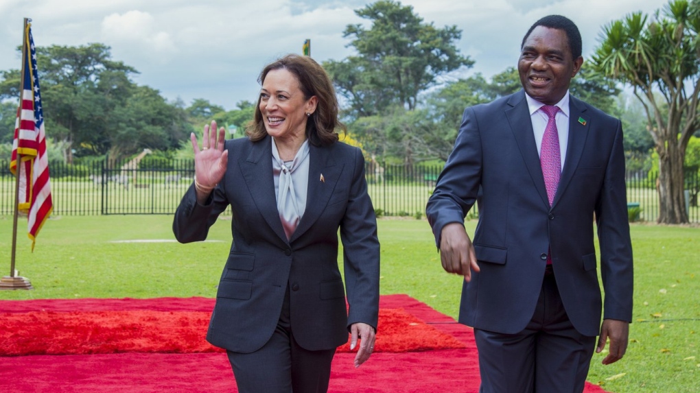 U.S. Vice President Kamala Harris, left, is greeted by Zambian President Hakainde Hichilema in Lusaka, Zambia, Friday March 31, 2023. Harris is on the last leg of a a seven-day African visit that took her to Ghana and Tanzania. (AP Photo/Salim Dawood)