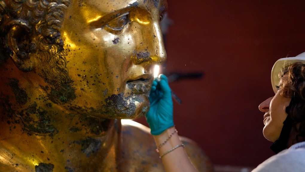 Vatican experts uncovering gilded glory of Hercules statue struck by lightning