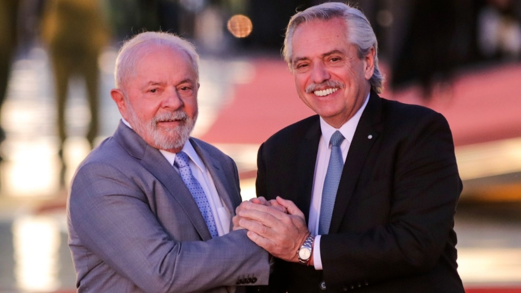Brazilian President Luiz Inacio Lula da Silva, left, and Argentine President Alberto Fernandez, pose for photos at the Alvorada palace in Brasilia, Brazil, Tuesday, May 2, 2023. AP Photo/Gustavo Moreno)