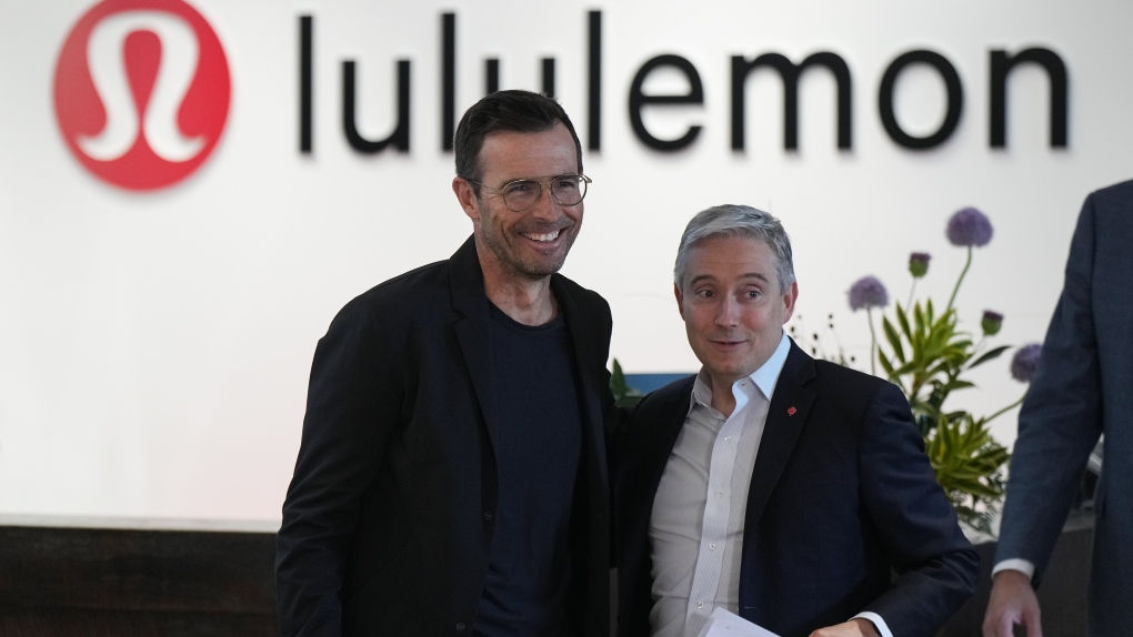 Lululemon CEO Calvin McDonald, left, and Minister of Innovation, Science and Industry, Francois-Philippe Champagne arrive for a news conference at the company's headquarters, in Vancouver, on Thursday, May 25, 2023. (THE CANADIAN PRESS/Darryl Dyck)