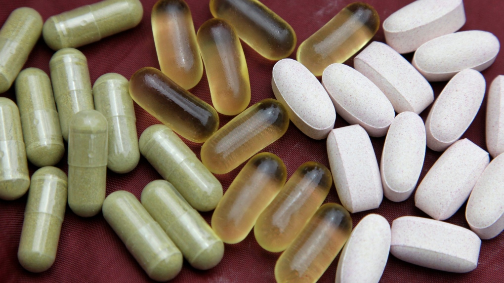 Echinacea, left, fish oil, centre, and glucosamine pills are shown in San Francisco, Thursday, July 30, 2009.