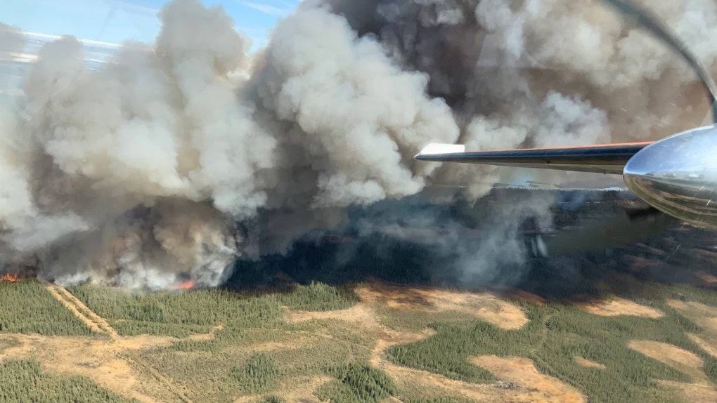 A view of a wildfire over Hay River, Northwest Territories from an air tanker is shown in a May 14, 2023 handout photo. (THE CANADIAN PRESS/HO-Northwest Territories Environment and Natural Resources)