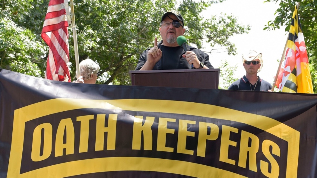 Stewart Rhodes, founder of the Oath Keepers, centre, speaks during a rally outside the White House in Washington, June 25, 2017.  (Susan Walsh / AP) 
