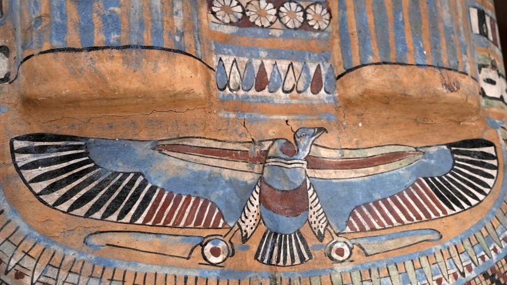 A coloured painting is seen on a recently unearthed ancient wooden sarcophagus at the site of the Step Pyramid of Djoser in Saqqara, 24 kilometres (15 miles) southwest of Cairo, Egypt, Saturday, May 27, 2023. (AP Photo/Amr Nabil)