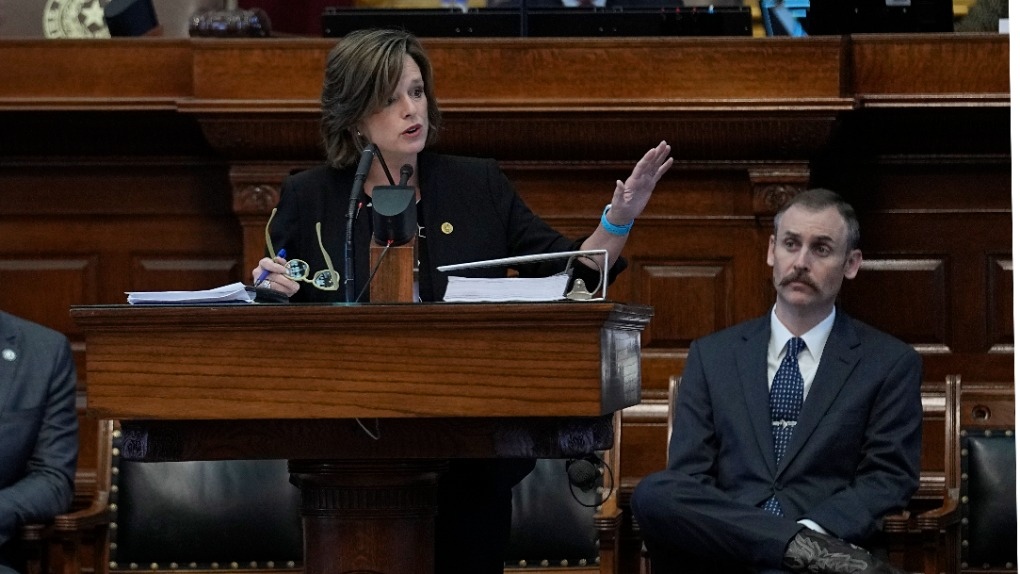 Rep. Andrew Murr, R - Junction, Chair of the House General Investigating Committee, right, listens as Rep. Ann Johnson, D - Houston, Vice Chair, speaks during the impeachment proceedings against state Attorney General Ken Paxton in the House Chamber at the Texas Capitol in Austin, Texas, Saturday, May 27, 2023. (AP Photo/Eric Gay)