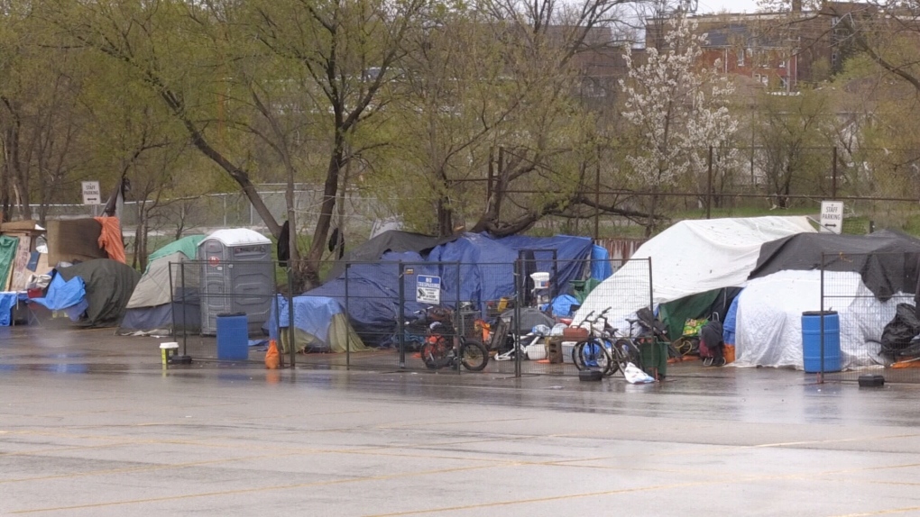 Hybrid shelter open, encampments remain with some unwilling to move