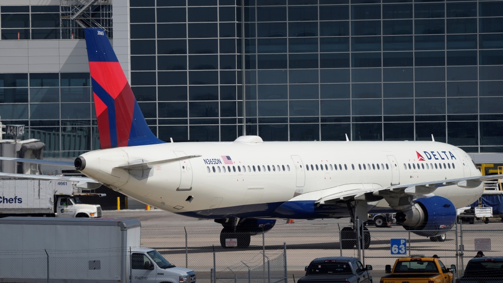 A Delta Airlines jetliner is pulled out of a gate at Denver International Airport Friday, May 26, 2023, in Denver. (AP Photo/David Zalubowski)