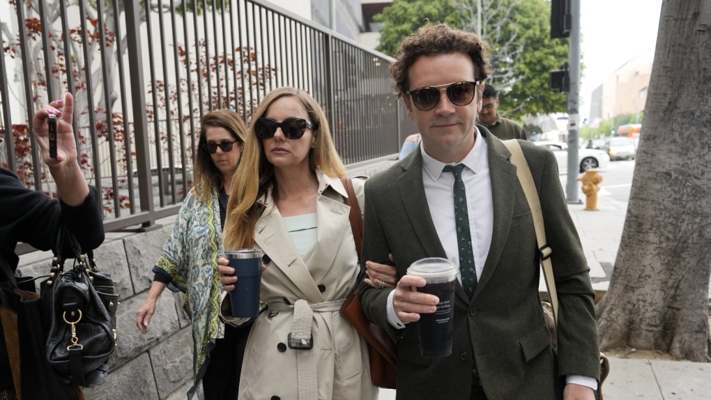 Danny Masterson, right, and his wife Bijou Phillips arrive for closing arguments in his second trial, May 16, 2023, in Los Angeles. A jury found “That ’70s Show” star Masterson guilty of two counts of rape Wednesday, May 31, in a Los Angeles retrial in which the Church of Scientology played a central role. (AP Photo/Chris Pizzello, File)