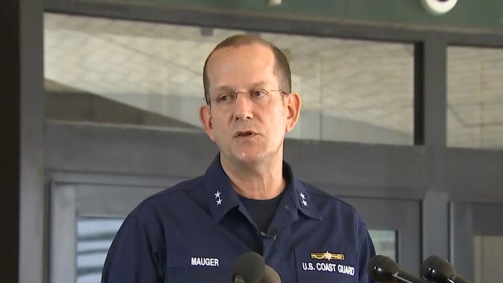 Rear Admiral John Mauger says a surface search has begun to locate the missing submarine that was carrying five people to the Titanic site.