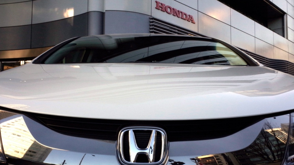The logo of Honda Motor Co. is seen on a Honda vehicle at the Japanese automaker's headquarters in Tokyo, Wednesday, Jan. 11, 2016. Honda is recalling nearly 1.2 million vehicles in the U.S. because the rear view camera image may not appear on the dashboard screen. The recall covers certain Odyssey minivans from 2018 to 2023, as well as Pilot SUVs from 2019 to 2022 and Passport SUVs from 2019 to 2023. (AP Photo/Shuji Kajiyama)