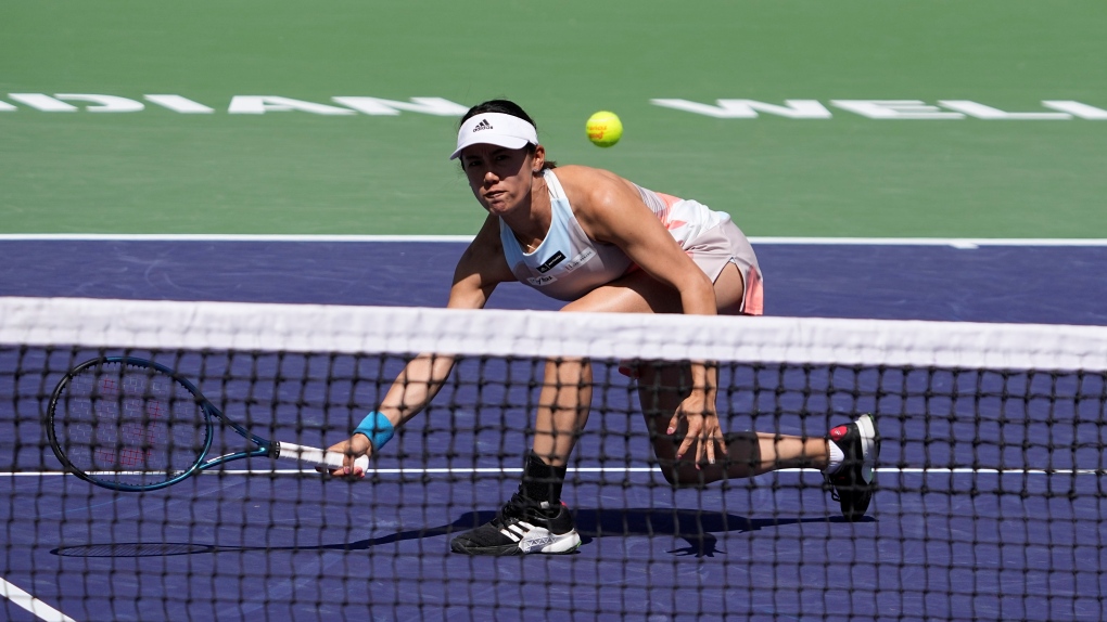 Miyu Kato, of Japan, returns as she and partner Aldila Sutjiadi, of Indonesia, play against Beatriz Haddad Maia, of Brazil, and Laura Siegemund, of Germany, in a doubles semifinal match at the BNP Paribas Open tennis tournament Friday, March 17, 2023, in Indian Wells, Calif. (AP Photo/Mark J. Terrill)