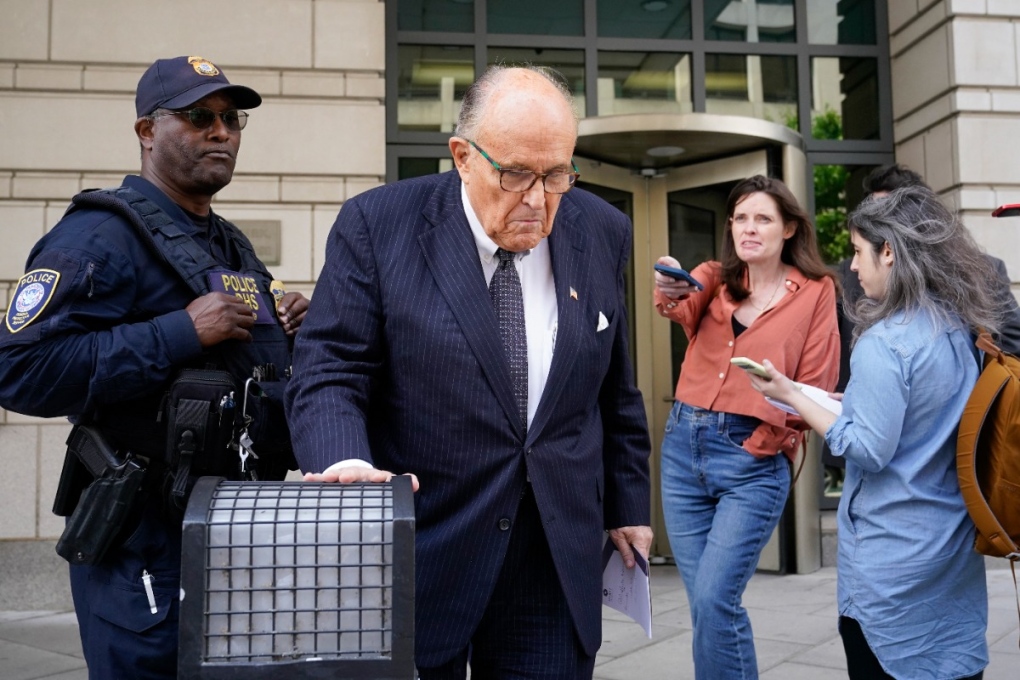 Former New York City Mayor Rudy Giuliani departs a federal courthouse, Friday, May 19, 2023, in Washington. Giuliani says a woman's lawsuit alleging he coerced her into sex is "a large stretch of the imagination" filled with exaggerations and salacious details "to create a media frenzy." (AP Photo/Patrick Semansky)