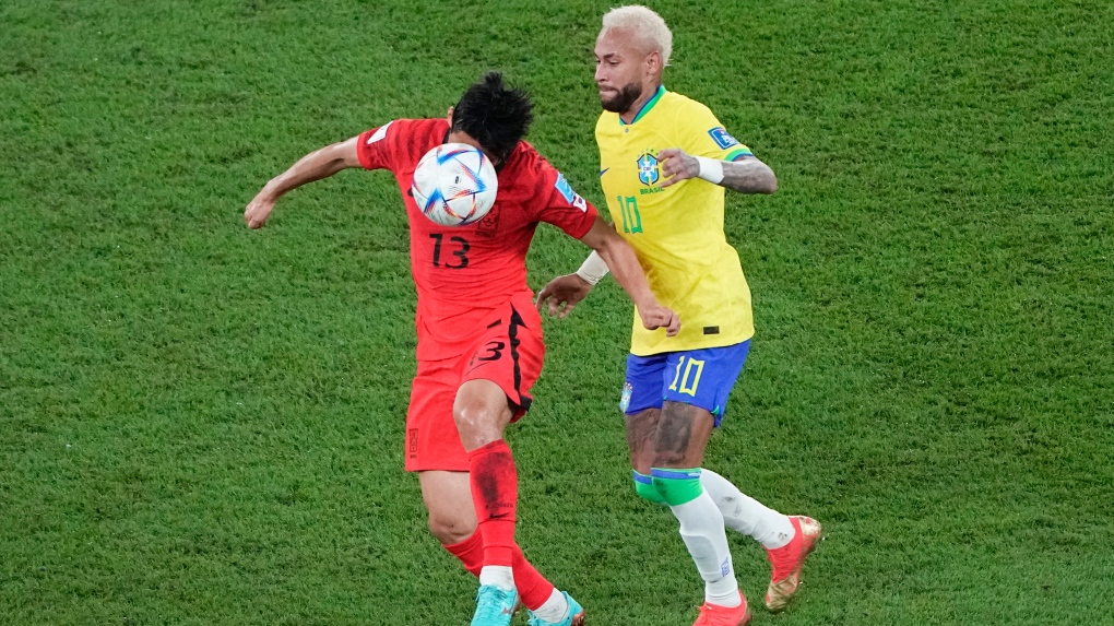 South Korea's Son Jun-ho, left, and Brazil's Neymar compete for possession during the World Cup round of 16 soccer match between Brazil and South Korea, at the Stadium 974 in Doha, Qatar, Monday, Dec. 5, 2022. (AP Photo/Ariel Schalit)