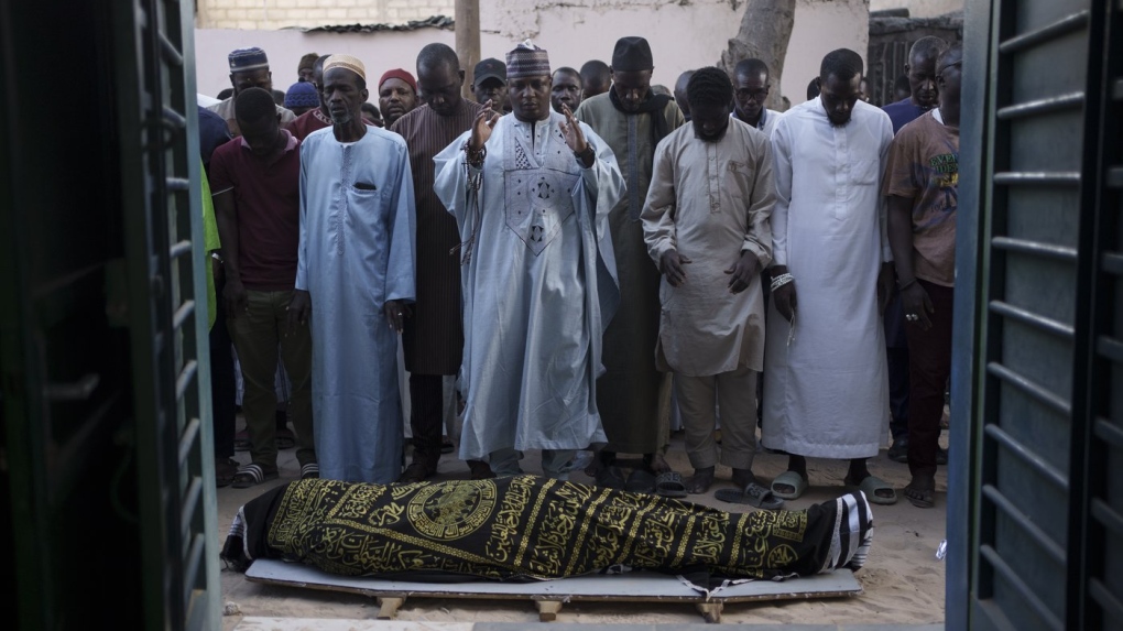 Friends and relatives of Elhaji Cisse pray during his funeral ceremony in front a local mosque in Dakar, Senegal, Monday, June 5, 2023. According to the family, the 26-year-old student was shot after leaving a mosque at a moment where security forces and demonstrators clashed nearby, last June 2. (AP Photo/Leo Correa)