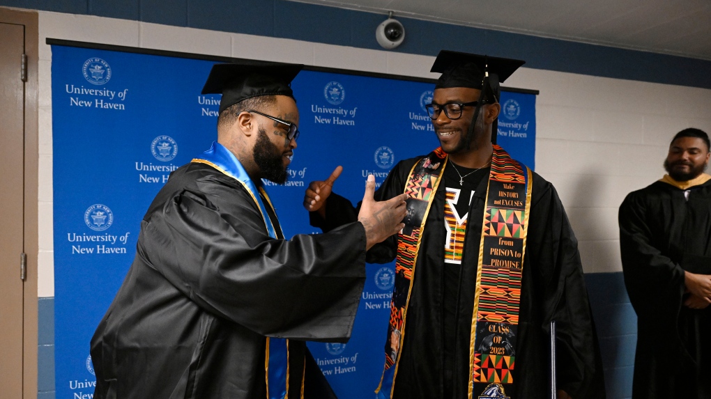 
Conceptually Similar Documents










Graduates Alpha Jalloh, left, and Marcus Harvin, right, congratulate each other at the first-ever college graduation ceremony at MacDougall-Walker Correctional Institution, Friday, June 9, 2023, in Suffield, Conn. The ceremony was held under a partnership established in 2021 by the University of New Haven and the Yale Prison Education Initiative. (AP Photo/Jessica Hill)