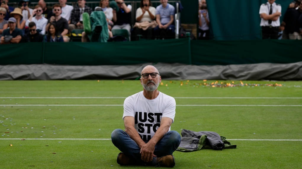 Environmental activists disrupt play at Wimbledon during match on Court 18
