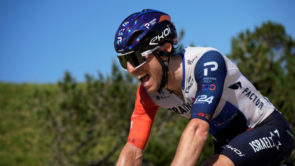 Canada's Michael Woods wins the ninth stage of the Tour de France cycling race over 182.5 kilometres with start in Saint-Leonard-de-Noblat and finish in Puy de Dome, France, Sunday, July 9, 2023. (AP Photo/Daniel Cole)