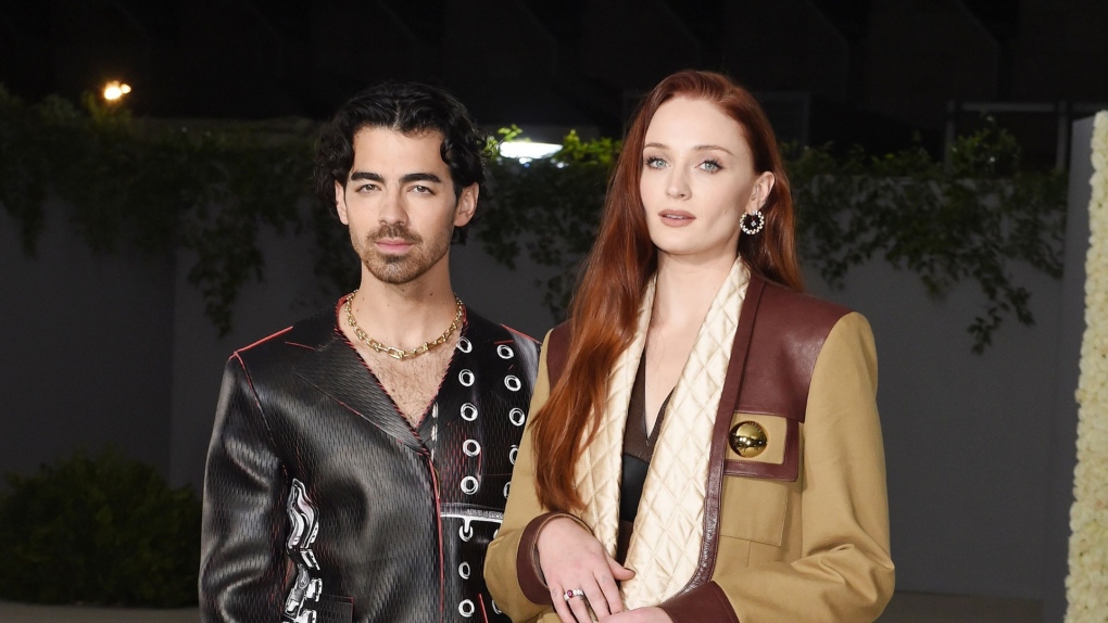 Joe Jonas and Sophie Turner, seen here in October 2022, are keeping their two young children in New York for now as part of a temporary court agreement. (Gilbert Flores/Variety/Getty Images/FILE)