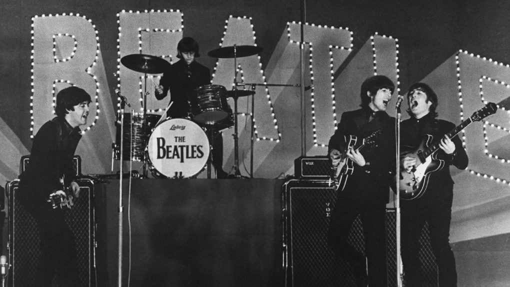 The Beatles perform during a concert at the Nippon Budokan in Tokyo in 1966. (Jiji Press/AFP/Getty Images files via CNN)