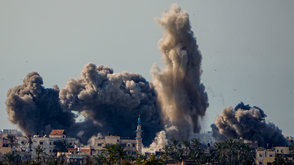 Smoke and explosion following an Israeli bombardment inside the Gaza Strip, as seen from southern Israel, Sunday, Feb. 11, 2024. (AP Photo/Ariel Schalit)