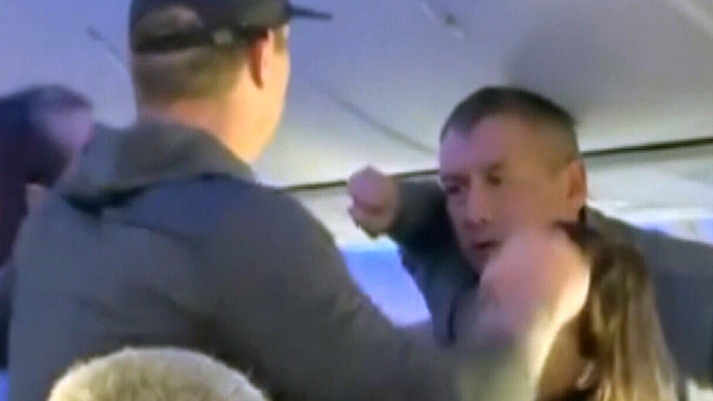 In a video posted to social media, two men onboard a Southwest airlines flight were caught in a heated, physical exchange mid-air.