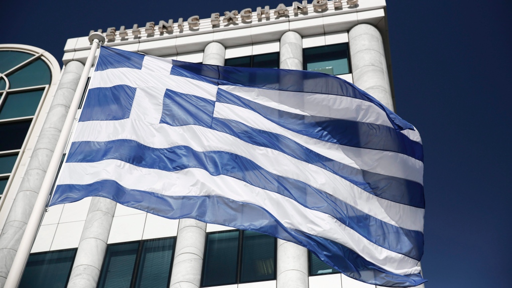 In this Feb. 3, 2015, file photo, a Greek flag flies outside the Athens Stock Exchange. (AP Photo/Petros Giannakouris, File)