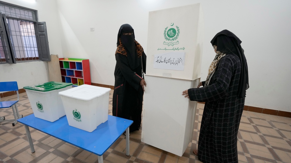 Members of the polling staff set up a polling station for the Feb. 8 parliamentary elections, in Karachi, Pakistan, Wednesday, Feb. 7, 2024. (AP Photo/Fareed Khan)