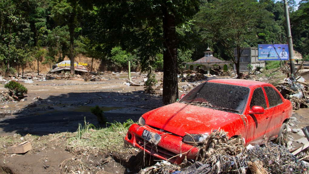 Flash floods and cold lava flow hit Indonesia's Sumatra island. At least 37 people were killed