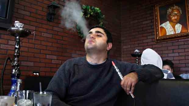 Man smokes hookah in Dearborn, Michigan