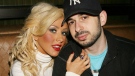 In this March 23, 2007 file photo originally provided by Starpix, singer Christina Aguilera and her husband Jordan Bratman attend a party at the Marquee club in New York. 