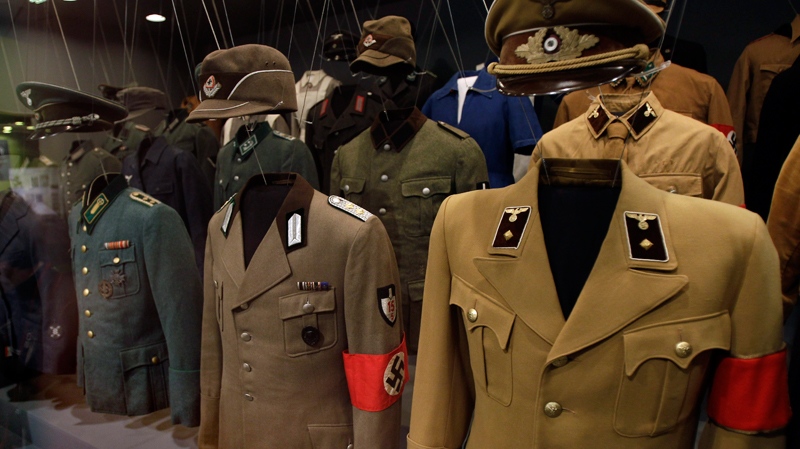 Various Nazi uniforms are pictured during a preview for the exhibition 'Hitler  and the Germans - nation and crime' in Berlin, Germany, Wednesday, Oct. 13, 2010. The exhibition runs from Oct. 15, 2010 until Feb. 6, 2011. (AP / Michael Sohn)