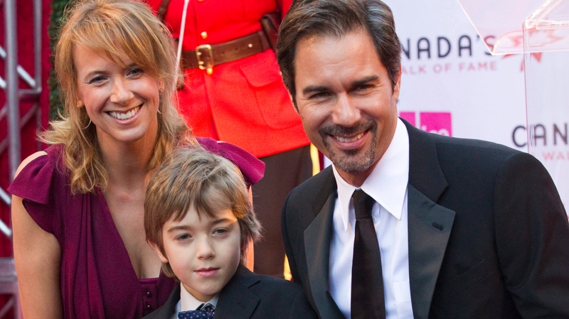 Actor Eric McCormack poses with his wife Janet and son Finnegan by his star at the Canada's Walk of Fame induction gala in Toronto on Saturday October 16, 2010. THE CANADIAN PRESS/Frank Gunn
