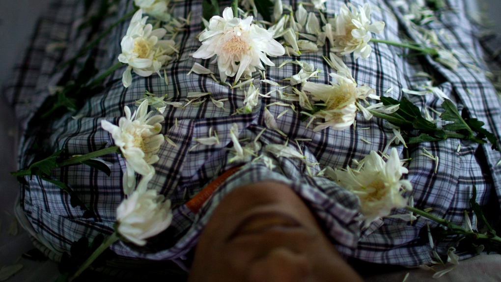 Chrysanthemum flowers arranged on HIV victim