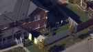 Police surround a Mississauga home where a man was reported to have been waving a sword on Monday, Oct. 22. 2012.
