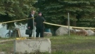 Investigators work at the scene where a body was discovered in Stratford, Ont. on Monday, Oct. 22, 2012.