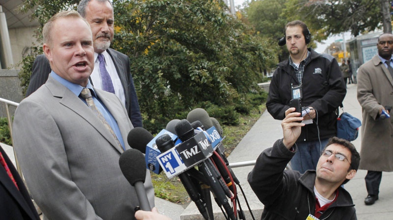 Steven Slater, left, speaks briefly to the media after leaving a Queens courthouse in New York, Tuesday, Oct. 19, 2010. (AP / Seth Wenig)
